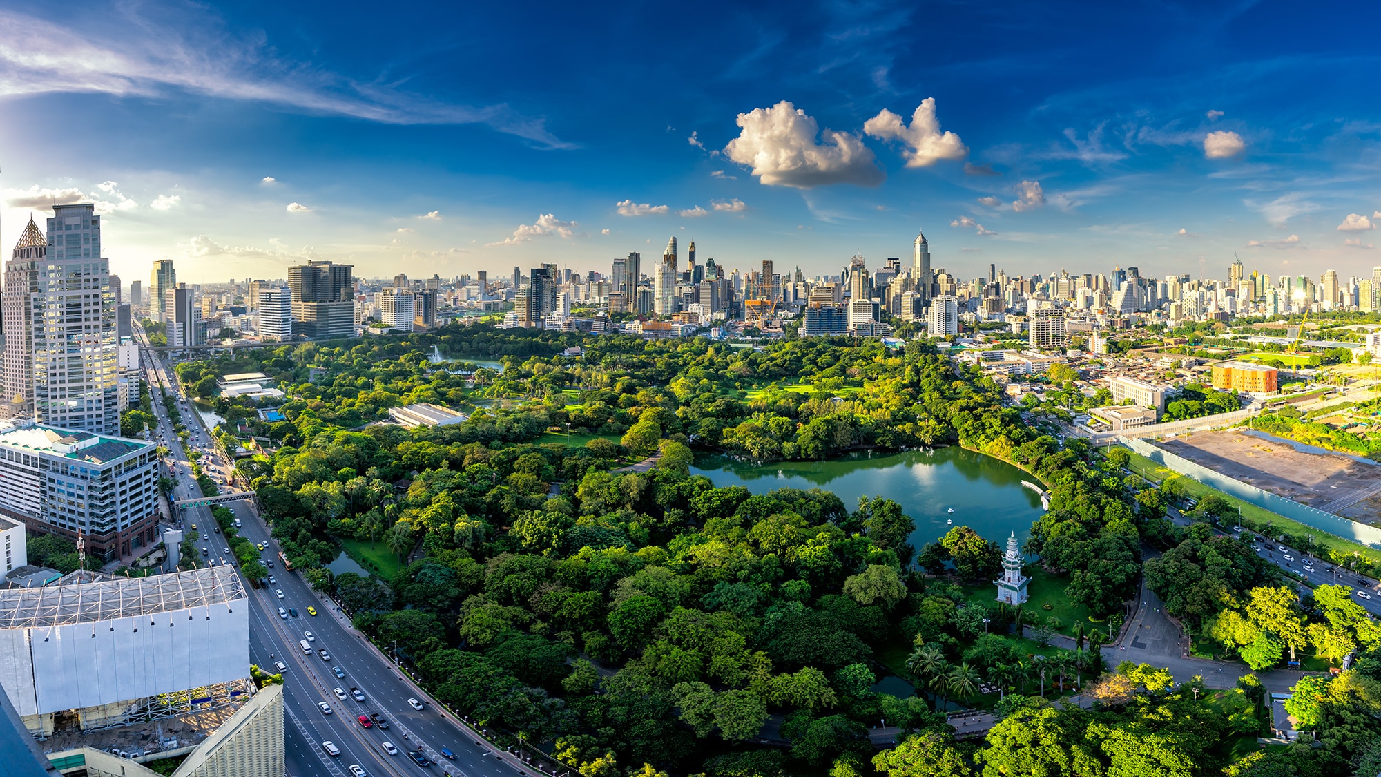 Majestic aerial view of Lumpini Park in middle of city