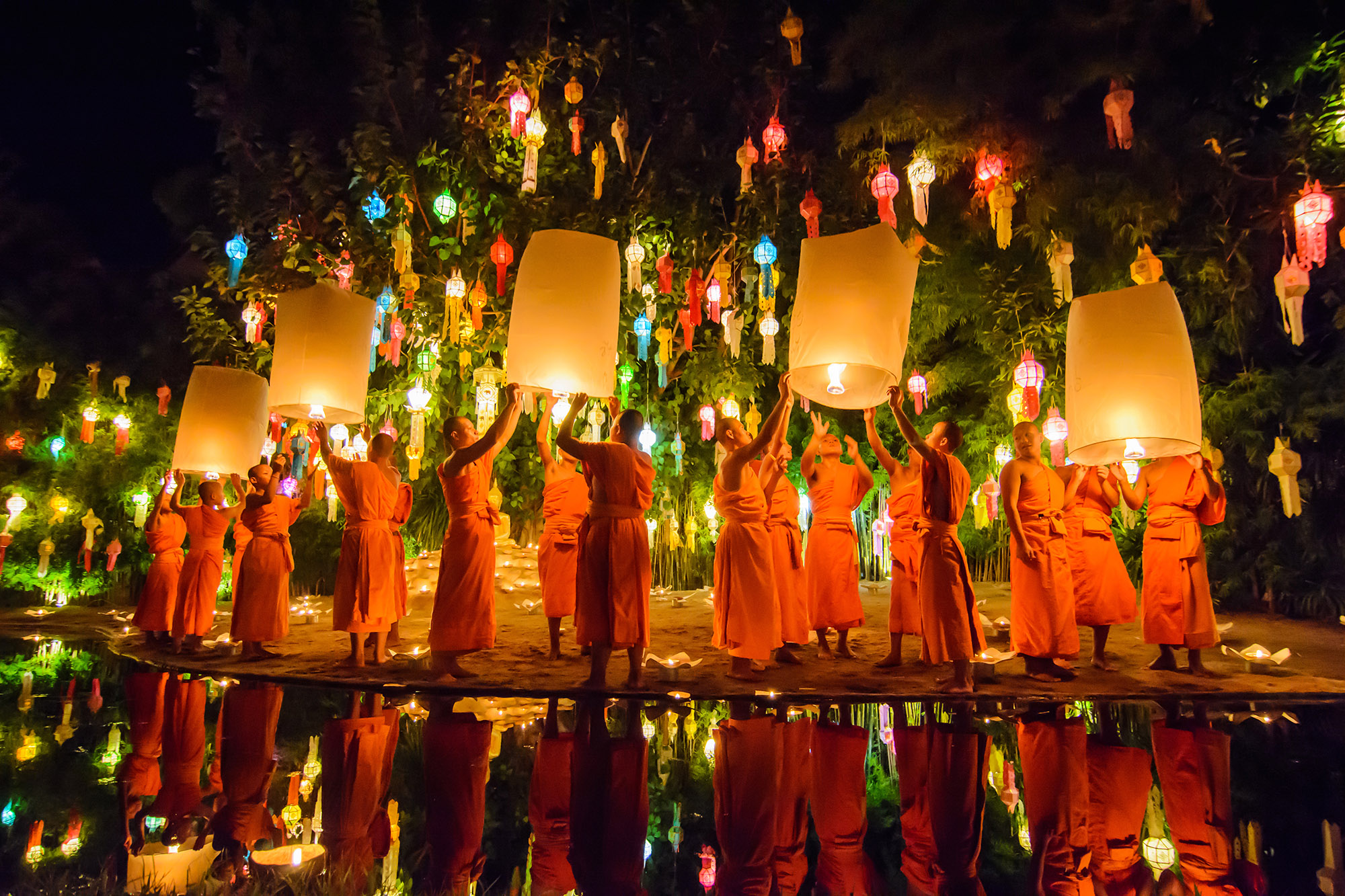 Monks trying to float a lit latern in Chiang mai