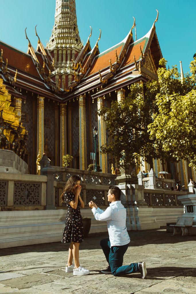Man proposing to his girlfriend at Wat Phra Kaew in Bangkok.